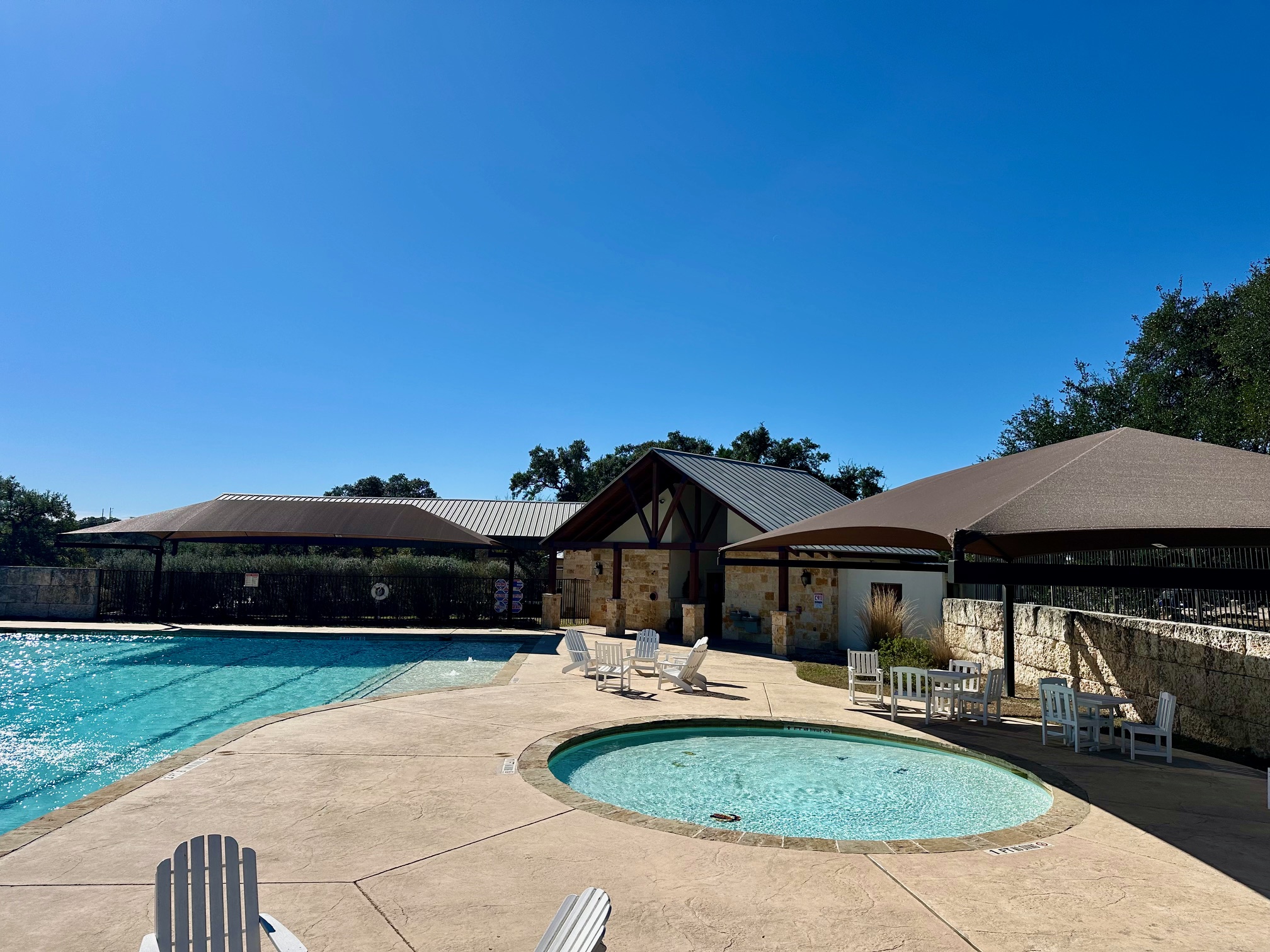 107 Jesse Stiff Blanco, TX 78606 - Photo 8 of 16 Community pool featuring a patio