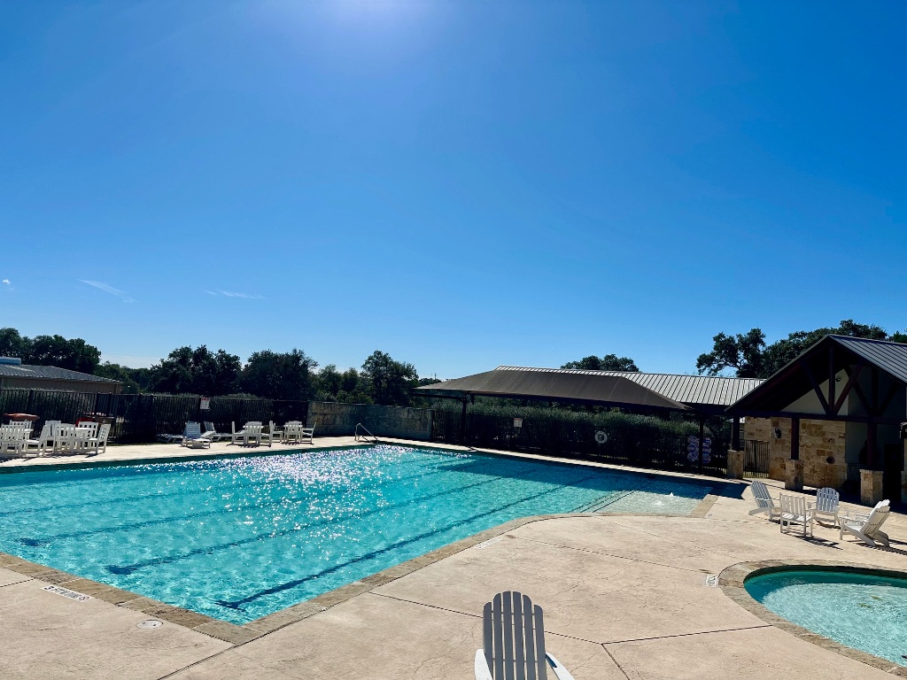 107 Jesse Stiff Blanco, TX 78606 - Photo 9 of 16 a view of house with backyard and outdoor seating