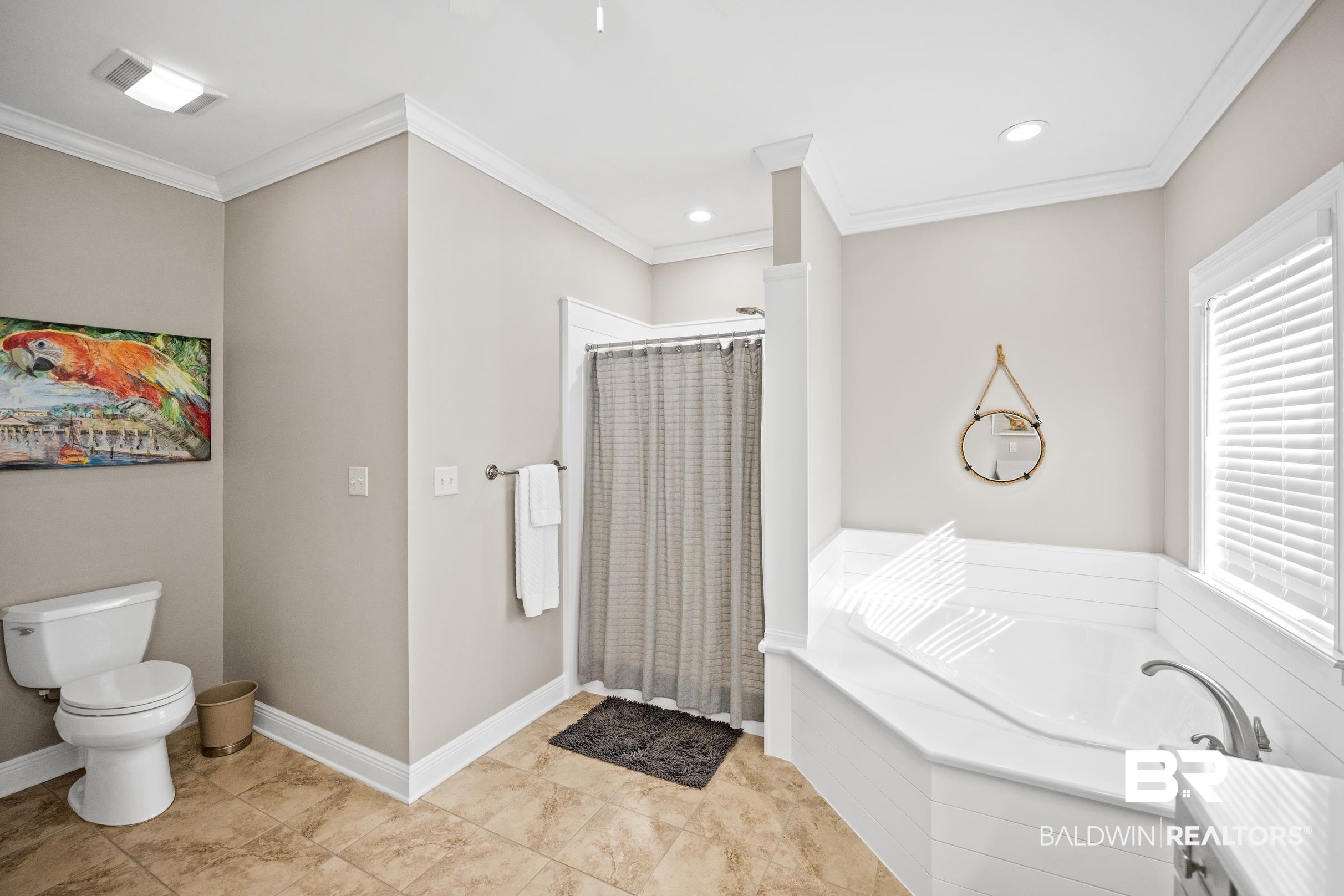 5217 Greentree Road Orange Beach, AL 36561 - Photo 42 of 58 Bathroom featuring a shower stall, a bath, and ornamental molding