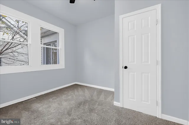 a view of empty room with windows