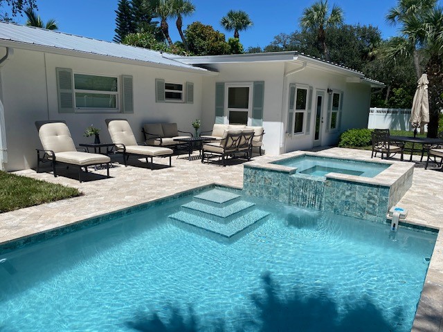 3816 Mockingbird Drive Vero Beach, FL 32963 - Photo 1 of 19 a view of a house with backyard and sitting area