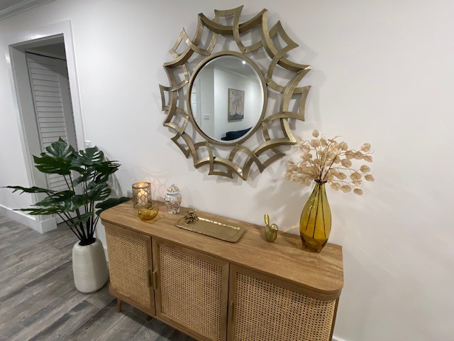 3816 Mockingbird Drive Vero Beach, FL 32963 - Photo 14 of 19 a vase of flowers sitting on a table