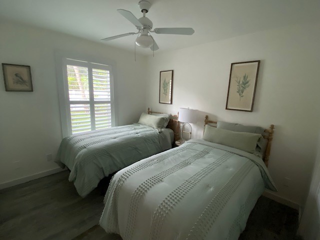 3816 Mockingbird Drive Vero Beach, FL 32963 - Photo 15 of 19 a bedroom with two beds and painting on the wall
