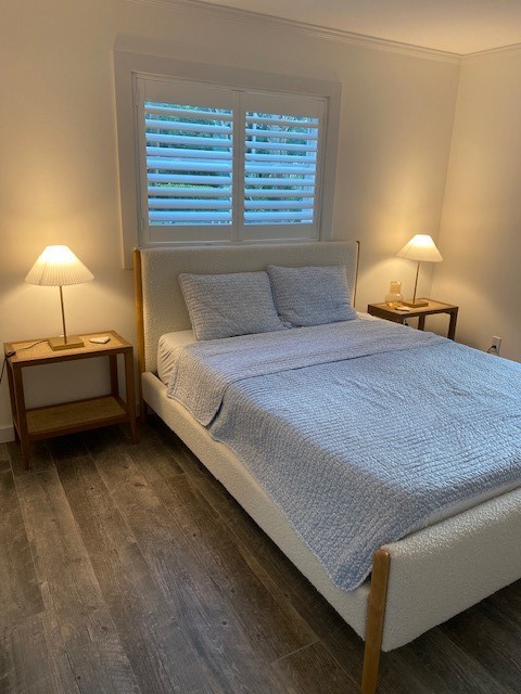 3816 Mockingbird Drive Vero Beach, FL 32963 - Photo 17 of 19 a bedroom with a bed and a lamp
