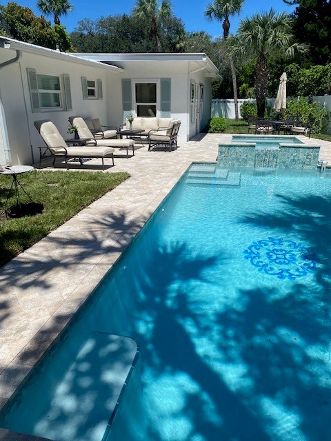 3816 Mockingbird Drive Vero Beach, FL 32963 - Photo 18 of 19 a view of a backyard with sitting area