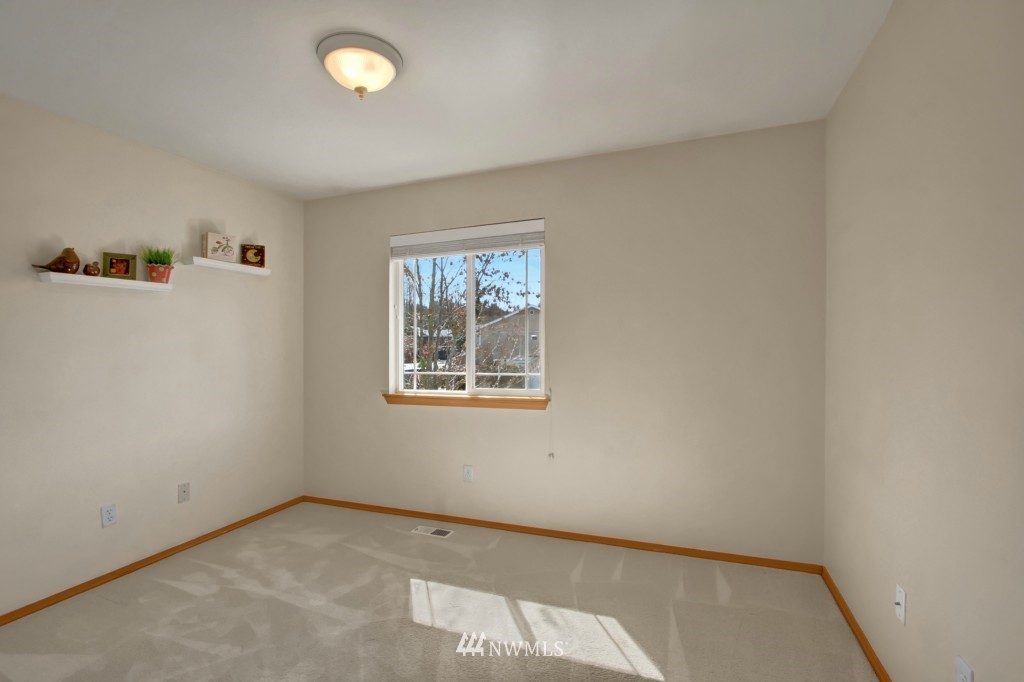 24219 13th Place West Bothell, WA 98021 - Photo 11 of 18 an empty room with windows