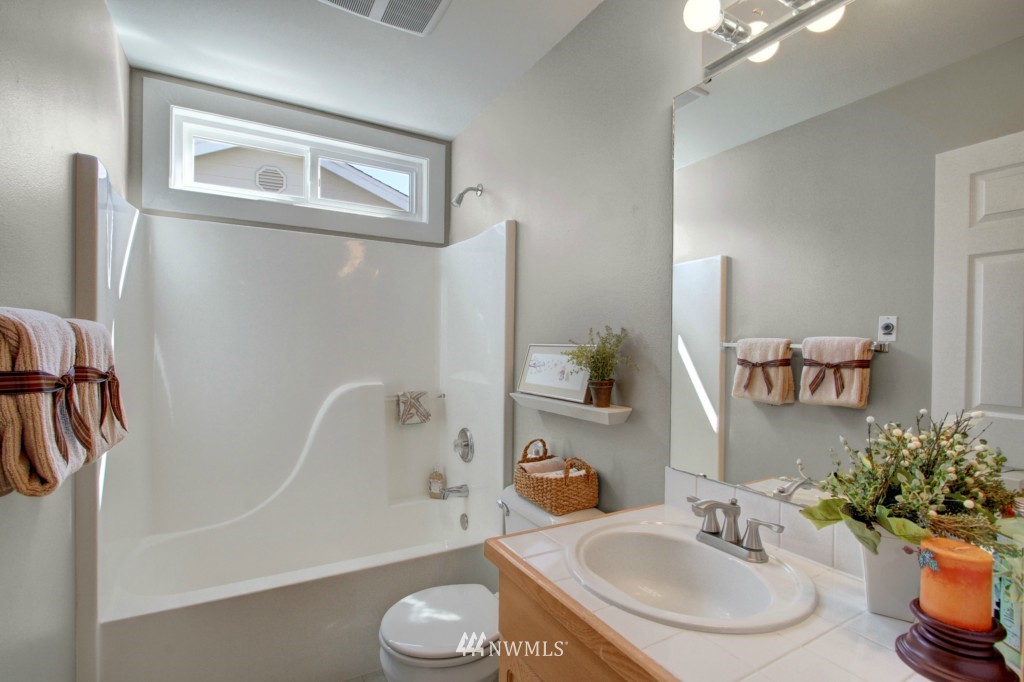 24219 13th Place West Bothell, WA 98021 - Photo 12 of 18 a bathroom with a sink and a mirror