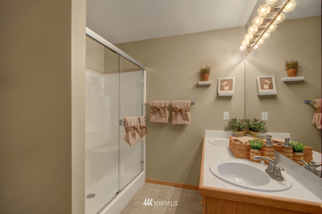 24219 13th Place West Bothell, WA 98021 - Photo 14 of 18 a bathroom with a sink toilet and shower