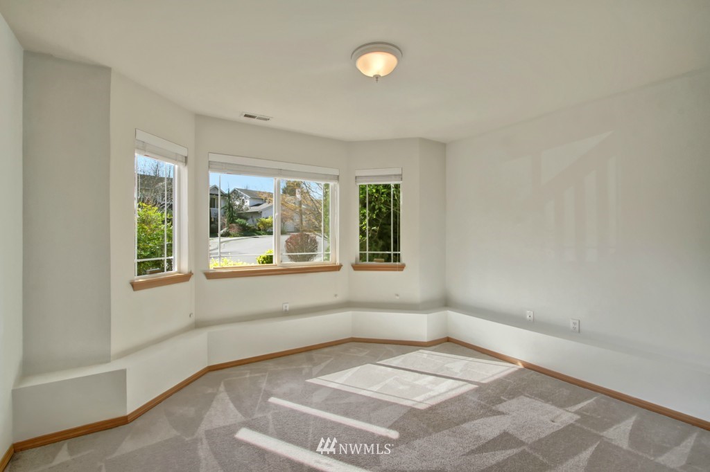 24219 13th Place West Bothell, WA 98021 - Photo 16 of 18 an empty room with a white walls and a large window