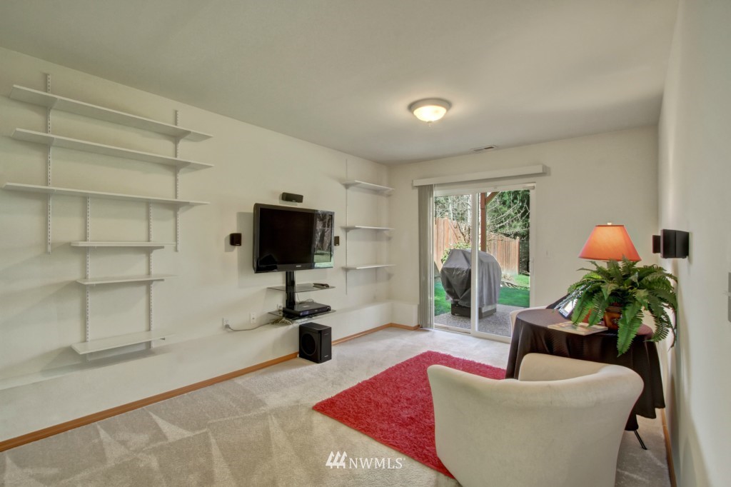 24219 13th Place West Bothell, WA 98021 - Photo 17 of 18 a living room with furniture and a flat screen tv