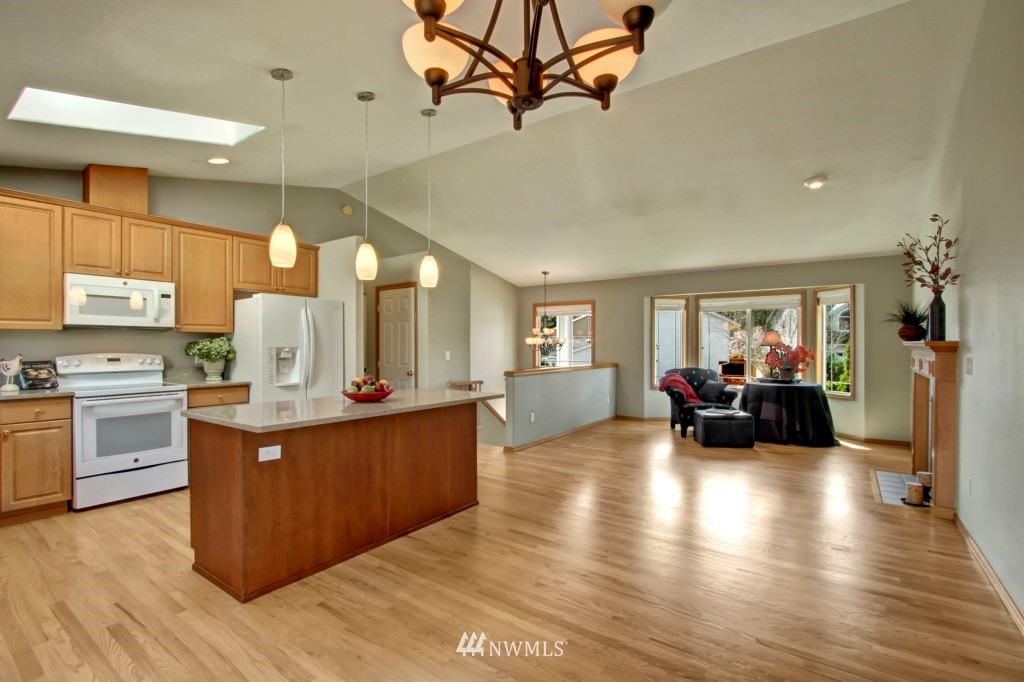 24219 13th Place West Bothell, WA 98021 - Photo 9 of 18 a kitchen with sink cabinets and wooden floor
