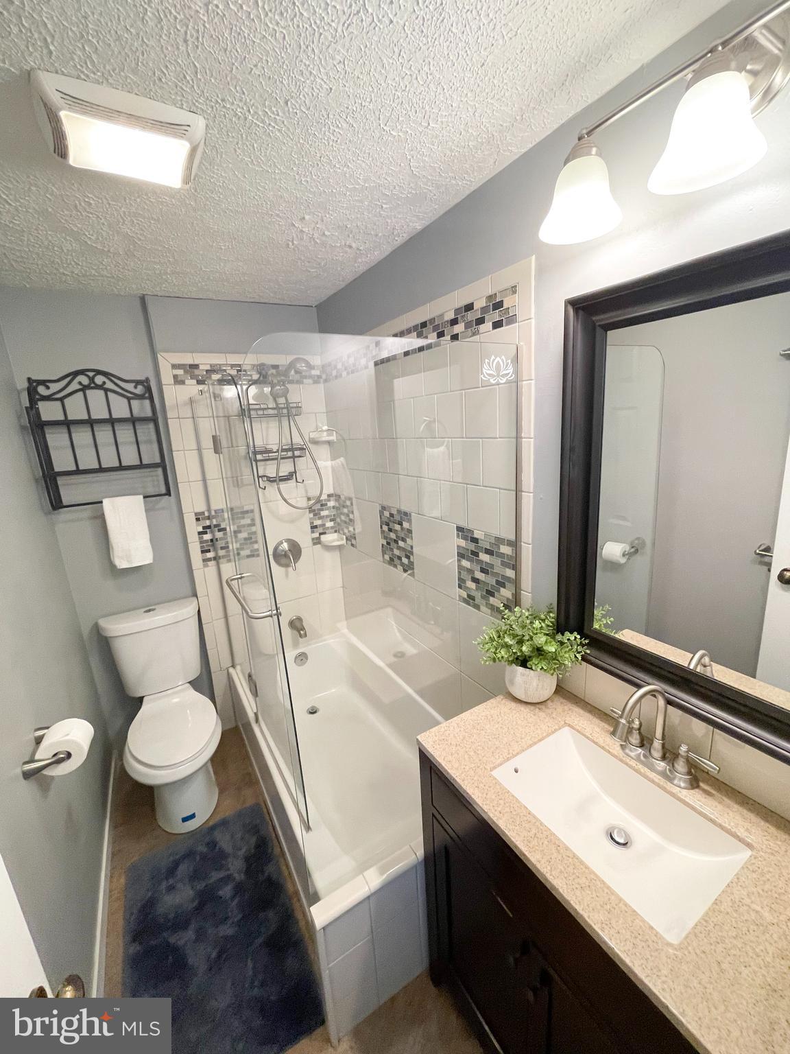 3115 Northmont Road Windsor Mill, MD 21244 - Photo 31 of 49 a bathroom with a sink toilet and shower