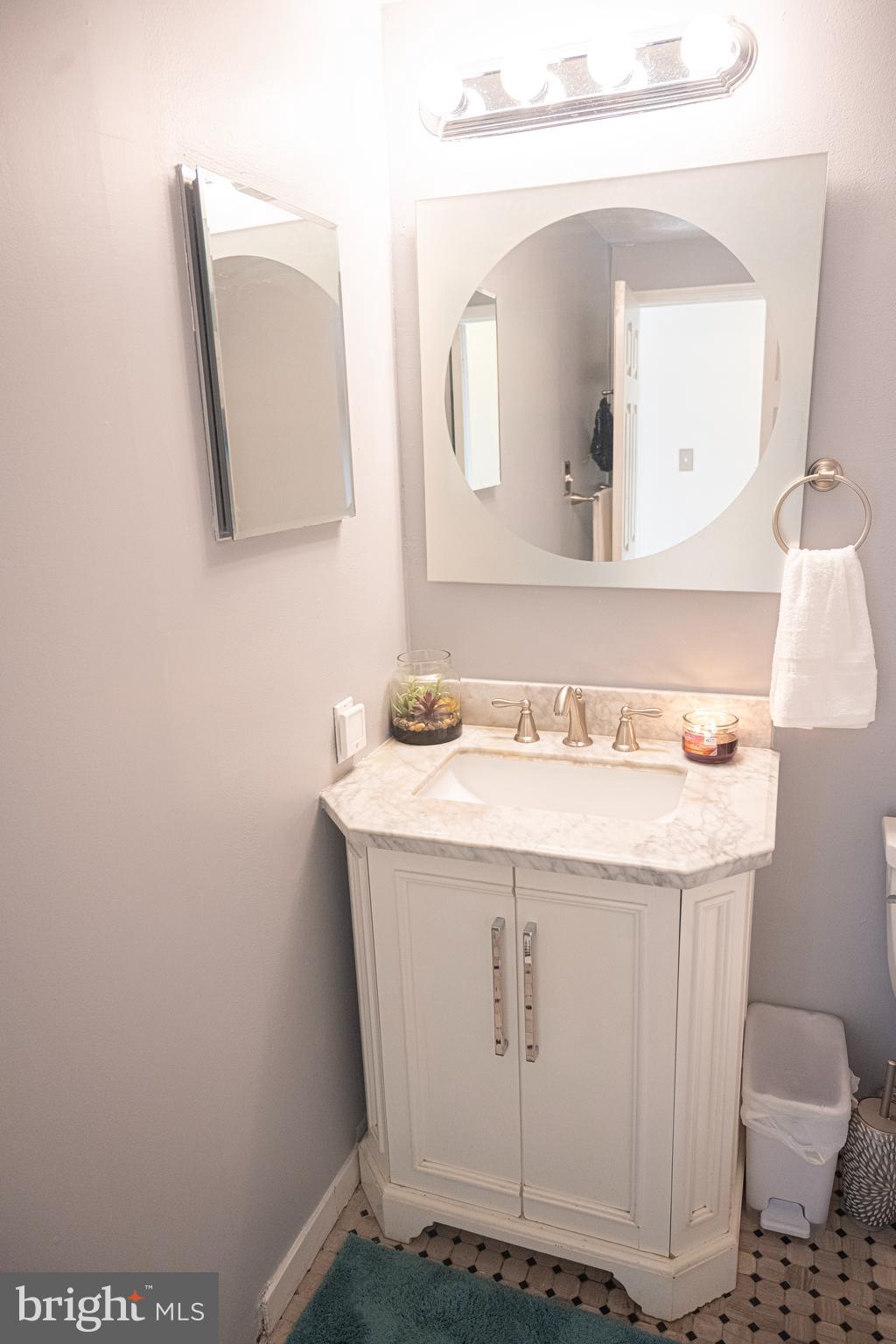 3115 Northmont Road Windsor Mill, MD 21244 - Photo 35 of 49 a bathroom with a sink and a mirror