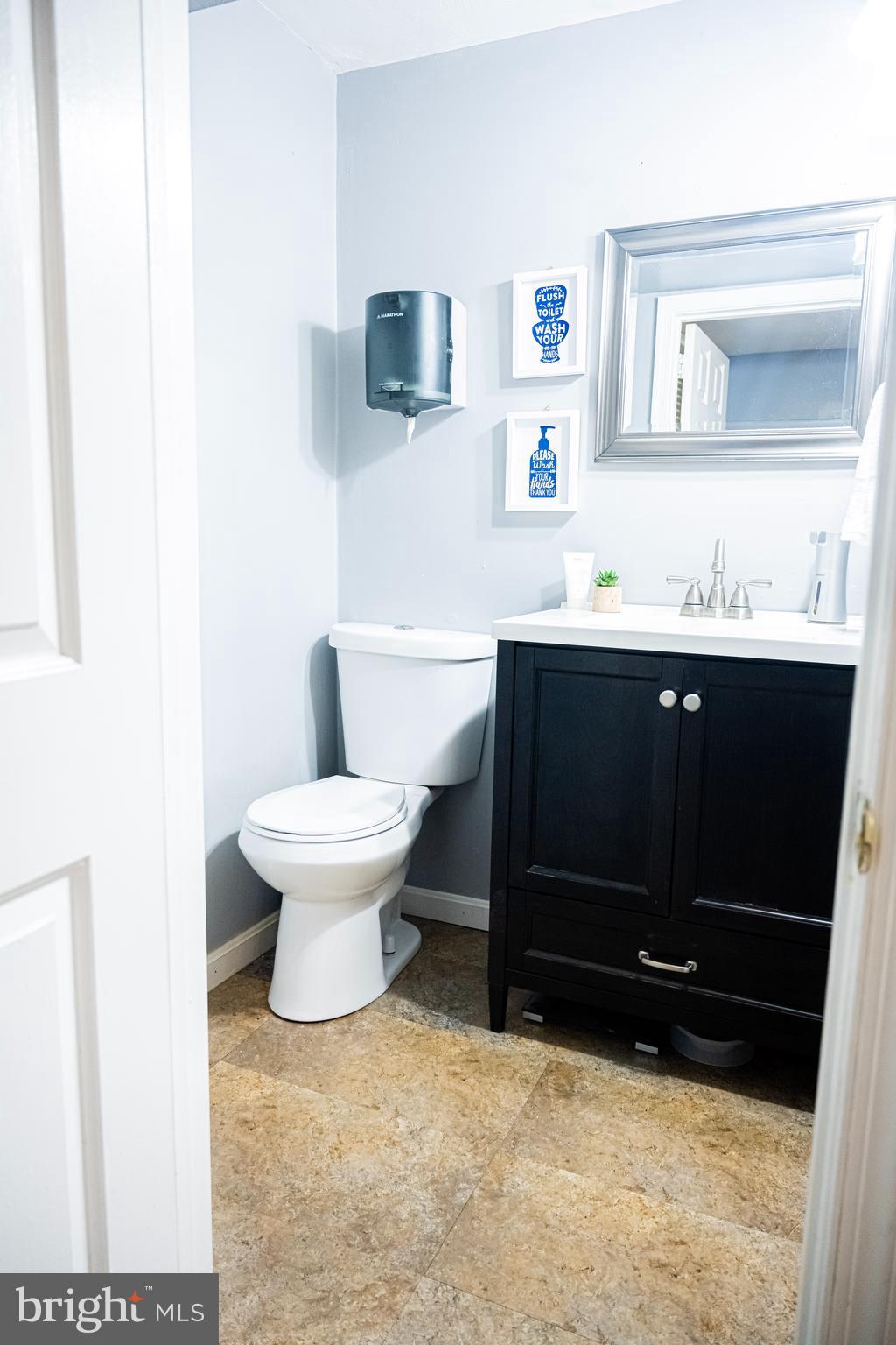3115 Northmont Road Windsor Mill, MD 21244 - Photo 39 of 49 a bathroom with a sink and a toilet
