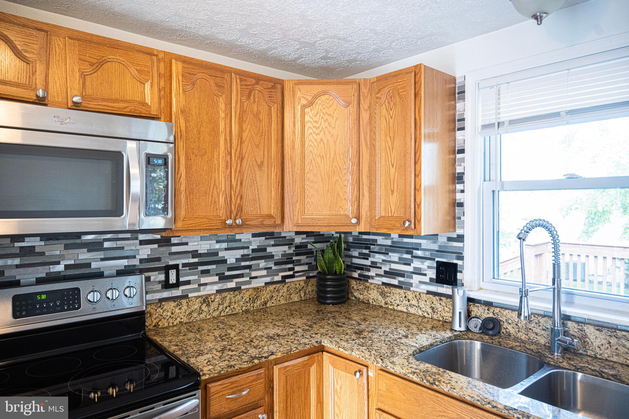 3115 Northmont Road Windsor Mill, MD 21244 - Photo 8 of 49 a kitchen with a sink and a stove top oven