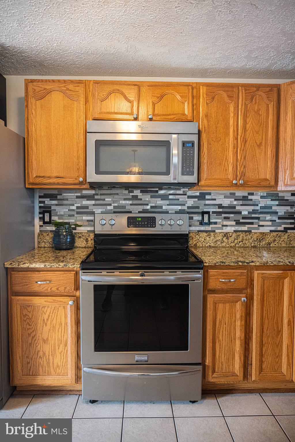 3115 Northmont Road Windsor Mill, MD 21244 - Photo 10 of 49 a stove top oven sitting inside of a kitchen
