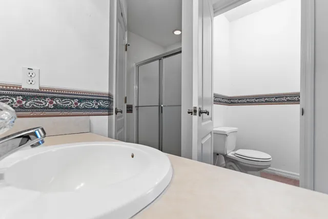 a view of backyard with patio