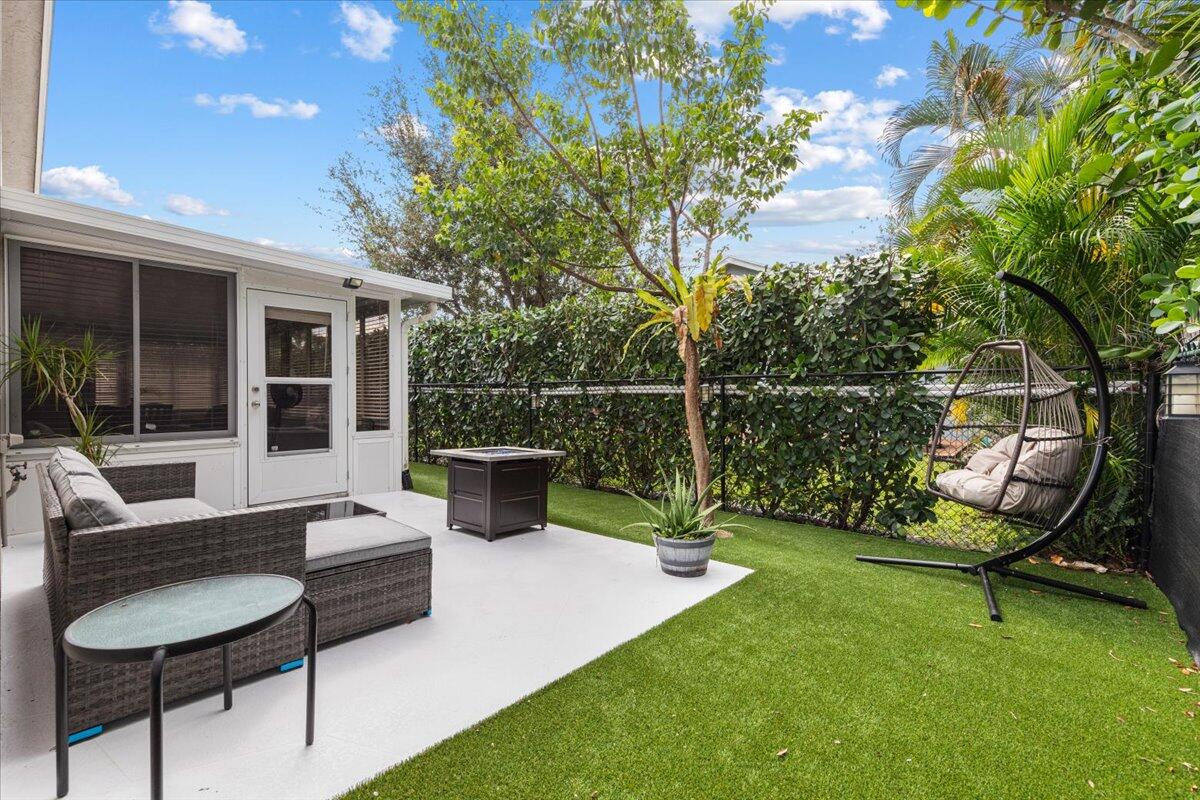 2484 Southwest Century Way Stuart, FL 34997 - Photo 23 of 56 Backyard patio and Sunroom
