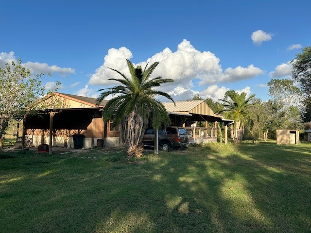 6083 Farm To Market 1462 Rosharon, TX 77583 - Photo 13 of 43 a front view of a house with a garden