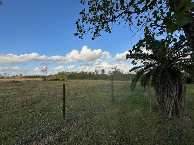 6083 Farm To Market 1462 Rosharon, TX 77583 - Photo 16 of 43 a view of a yard with an outdoor space