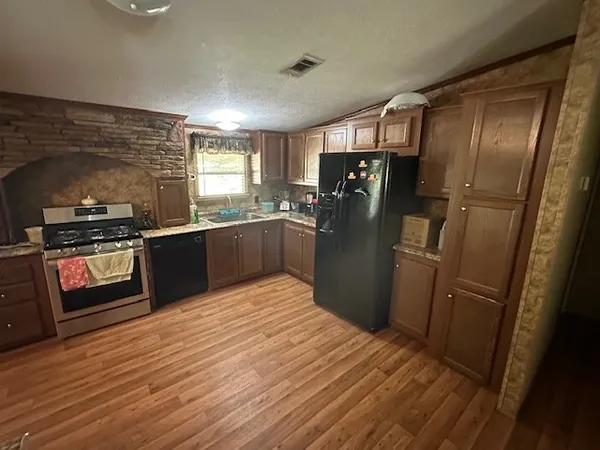 a kitchen with a table and chairs in it