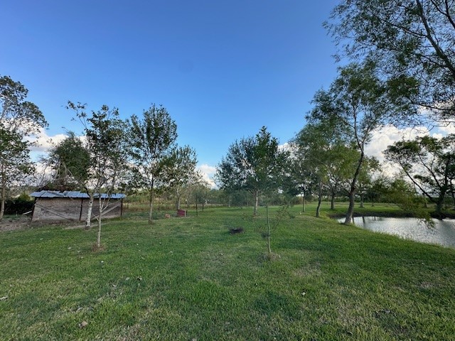 6083 Farm To Market 1462 Rosharon, TX 77583 - Photo 5 of 43 a view of outdoor space with deck and yard