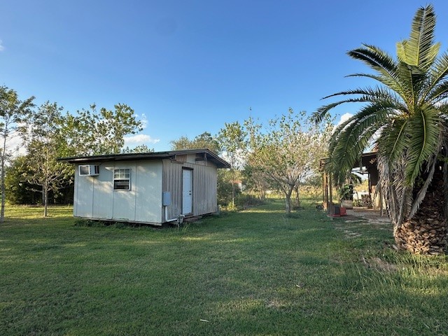 6083 Farm To Market 1462 Rosharon, TX 77583 - Photo 10 of 43 a view of a backyard with a garden