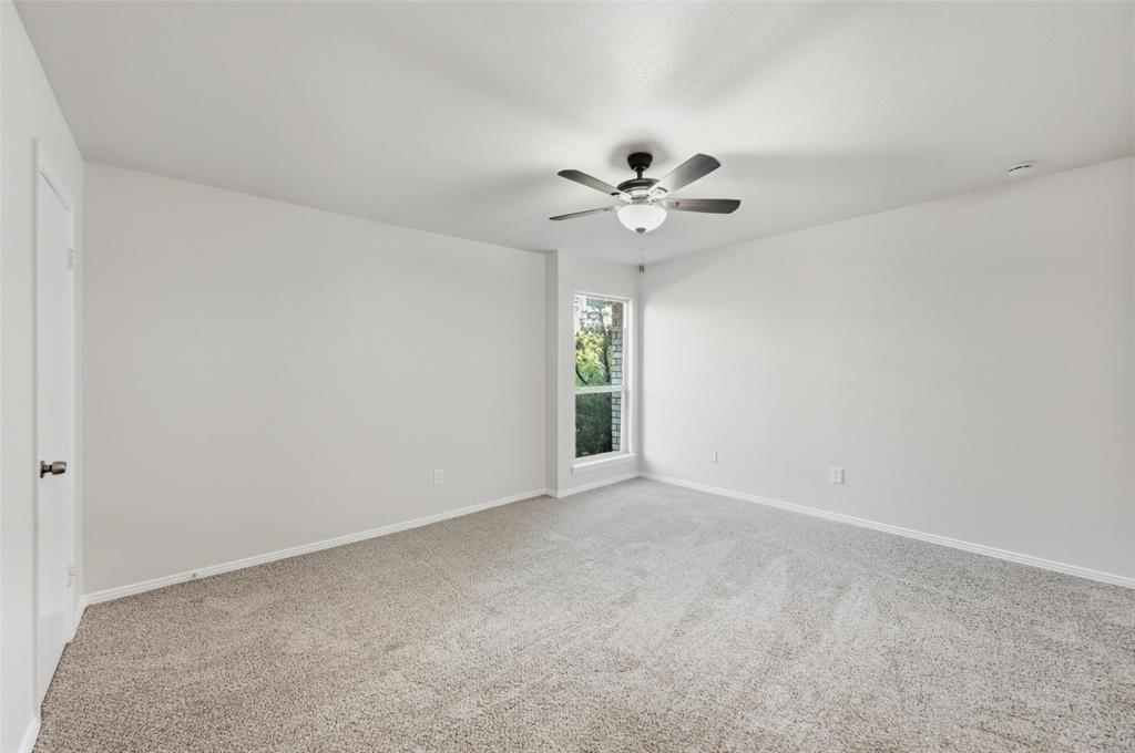 2702 Douglas Avenue, Unit 121 Dallas, TX 75219 - Photo 27 of 34 a view of an empty room with a window