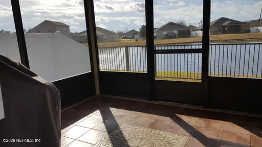 a view of balcony and yard