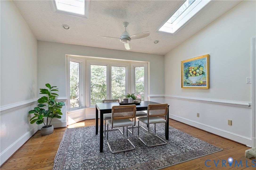 10000 Ramsbury Way Richmond, VA 23238 - Photo 19 of 59 a dining room with wooden floor and a rug