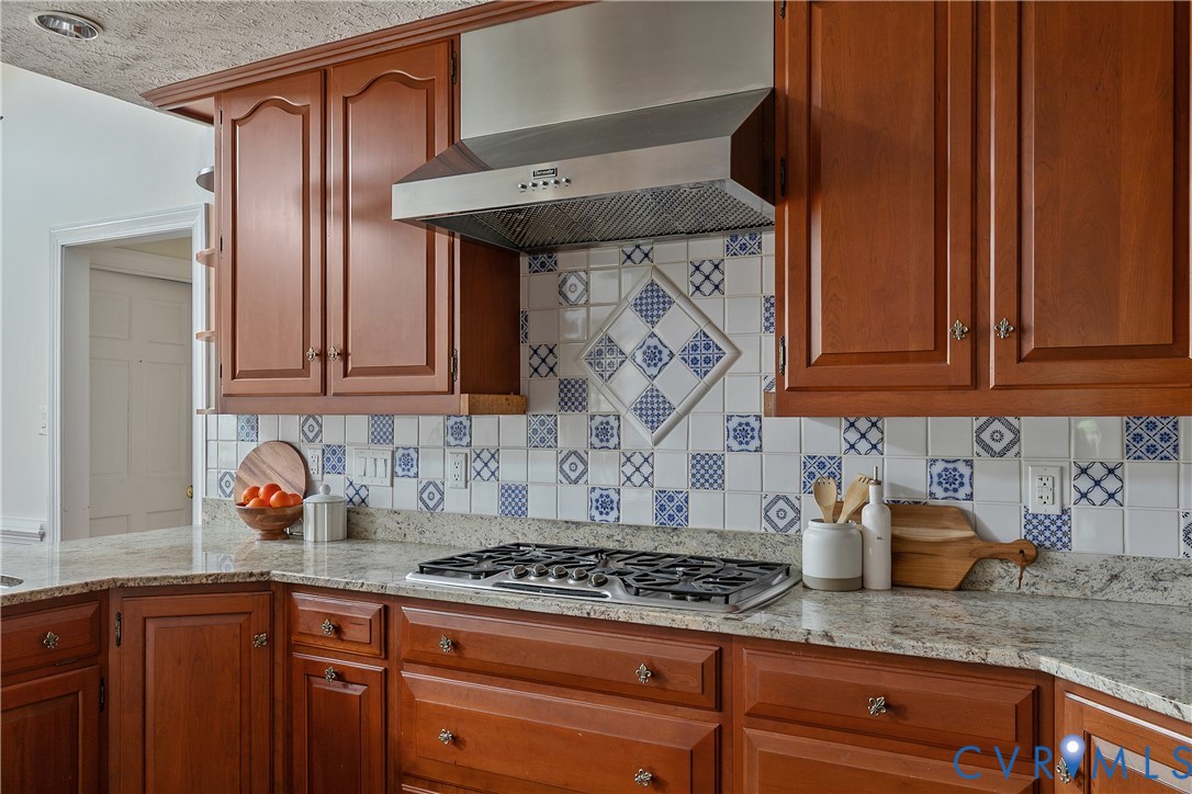 10000 Ramsbury Way Richmond, VA 23238 - Photo 24 of 59 a kitchen with stainless steel appliances granite countertop a sink stove and cabinets