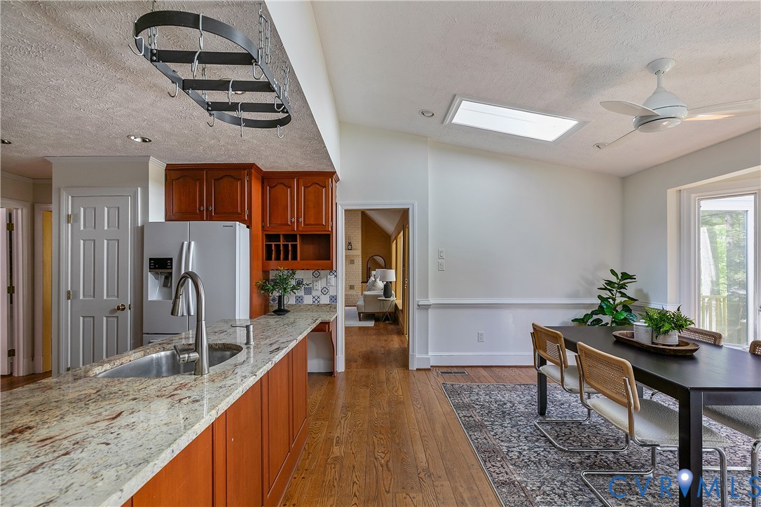 10000 Ramsbury Way Richmond, VA 23238 - Photo 25 of 59 a hallway with a dining table and a stove