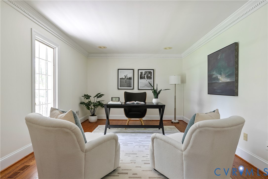 10000 Ramsbury Way Richmond, VA 23238 - Photo 28 of 59 a living room with furniture a large window and a flat screen tv