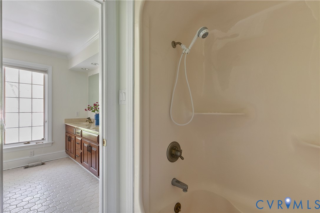 10000 Ramsbury Way Richmond, VA 23238 - Photo 34 of 59 a bathroom with a tub shower and a sink