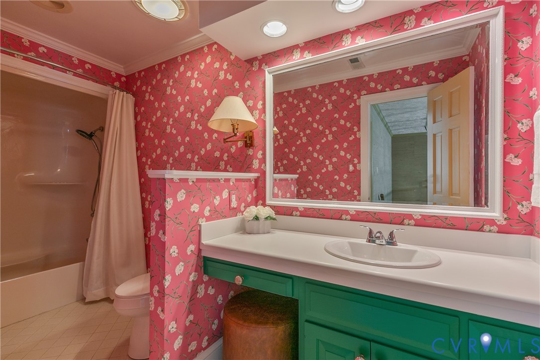 10000 Ramsbury Way Richmond, VA 23238 - Photo 43 of 59 a bathroom with a sink and a mirror