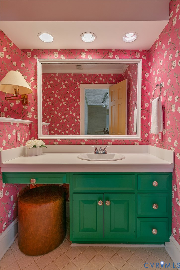 10000 Ramsbury Way Richmond, VA 23238 - Photo 44 of 59 a bathroom with a sink and mirror