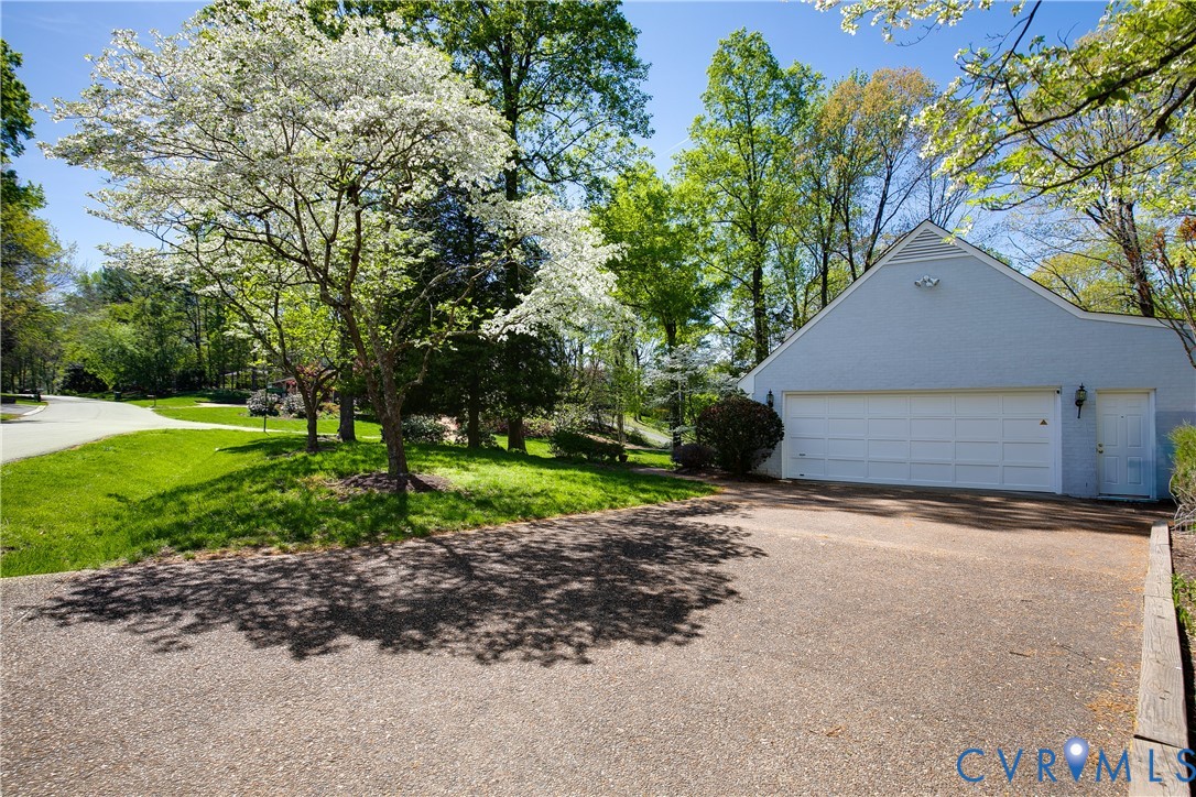 10000 Ramsbury Way Richmond, VA 23238 - Photo 52 of 59 a view of a house with a yard and garage