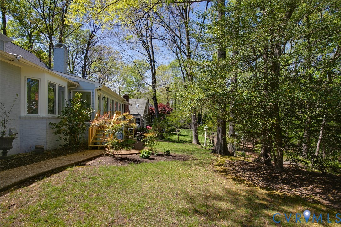 10000 Ramsbury Way Richmond, VA 23238 - Photo 54 of 59 a view of backyard with a table and chairs