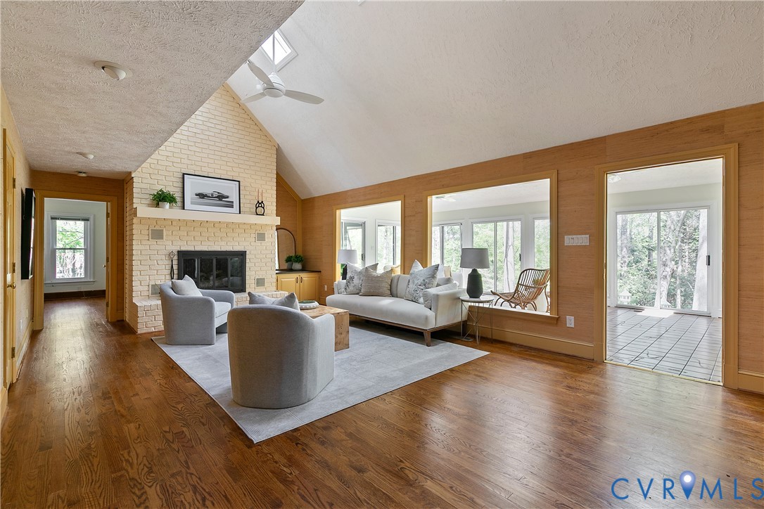 10000 Ramsbury Way Richmond, VA 23238 - Photo 10 of 59 a living room with fireplace furniture and a wooden floor