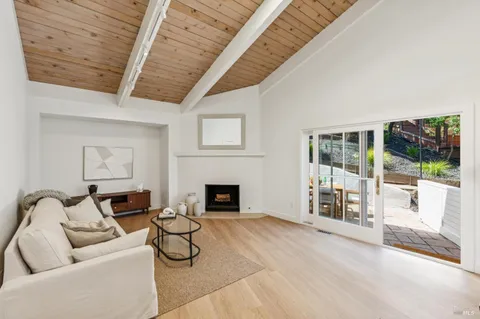 a view of entryway with wooden floor and window