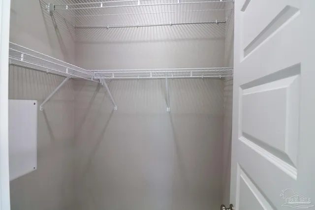 a view of a room with racks on the wall