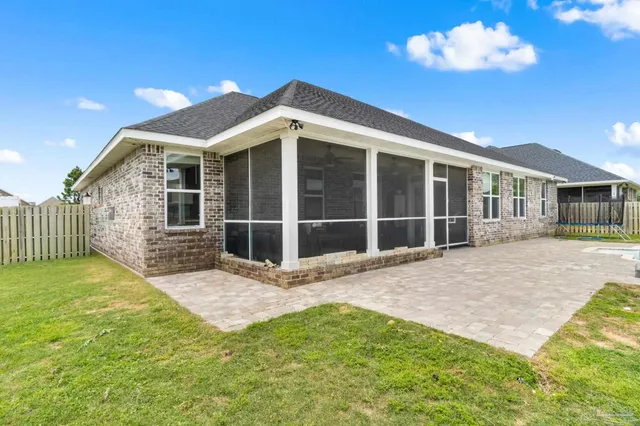 a view of a backyard with swimming pool