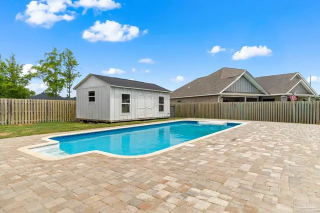 a view of a house with a swimming pool