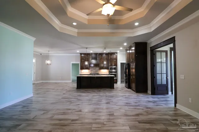 a room with a sink and a large mirror