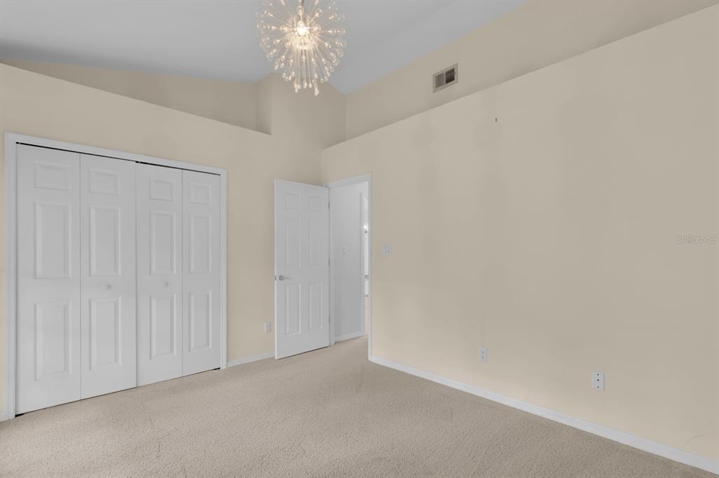 625 Nighthawk Circle Winter Springs, FL 32708 - Photo 18 of 36 a view of a chandelier fan and hardwood floor