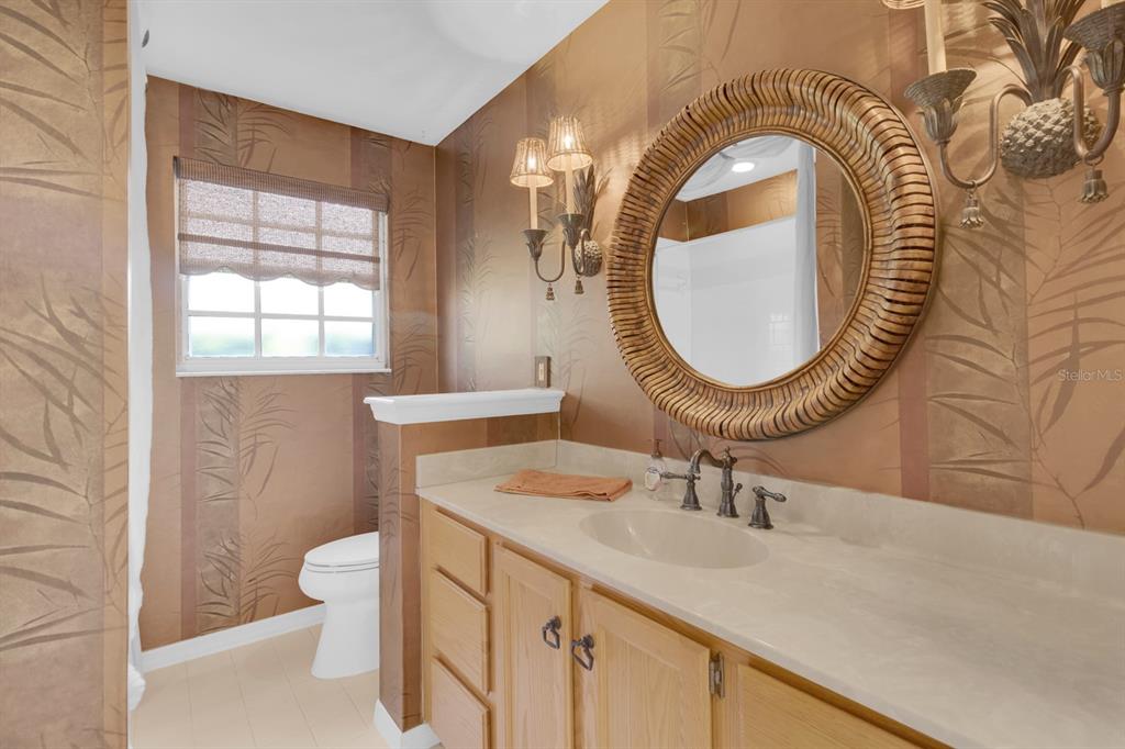 625 Nighthawk Circle Winter Springs, FL 32708 - Photo 19 of 36 a bathroom with a sink and a mirror