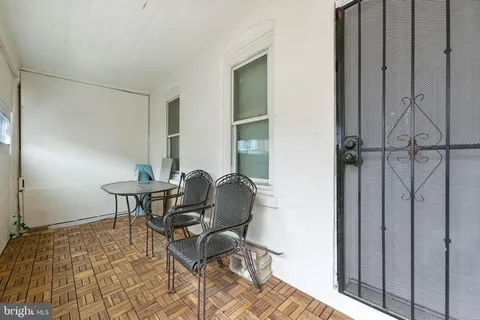 a work room with furniture and windows