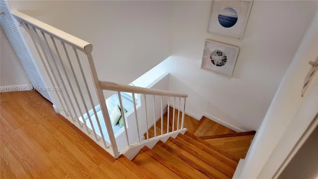 a bedroom with a bed and a night stand