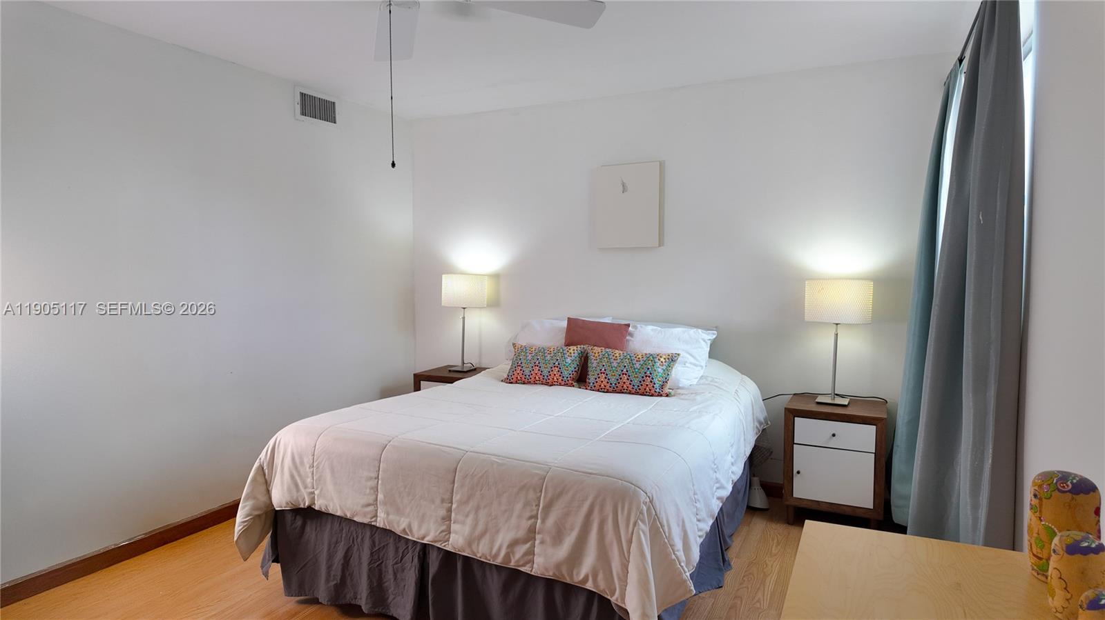 4555 Southwest 68th Ct Circle, Unit 111 Miami, FL 33155 - Photo 15 of 33 a bedroom with a bed and a night stand