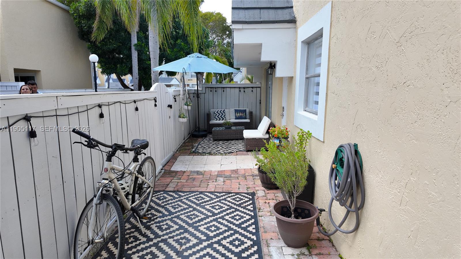 4555 Southwest 68th Ct Circle, Unit 111 Miami, FL 33155 - Photo 27 of 33 a view of a porch with furniture